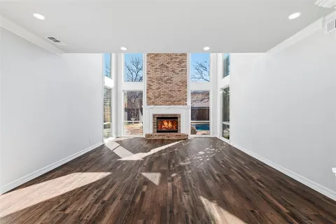 a kitchen with stainless steel appliances a refrigerator and a stove top oven