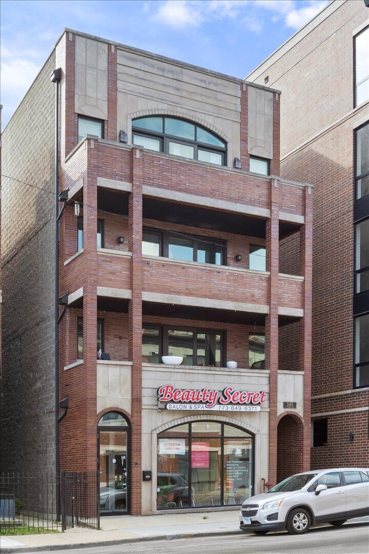 2463 West Foster Avenue, Unit 3 Chicago, IL 60625 - Photo 2 of 31 a front view of building with street