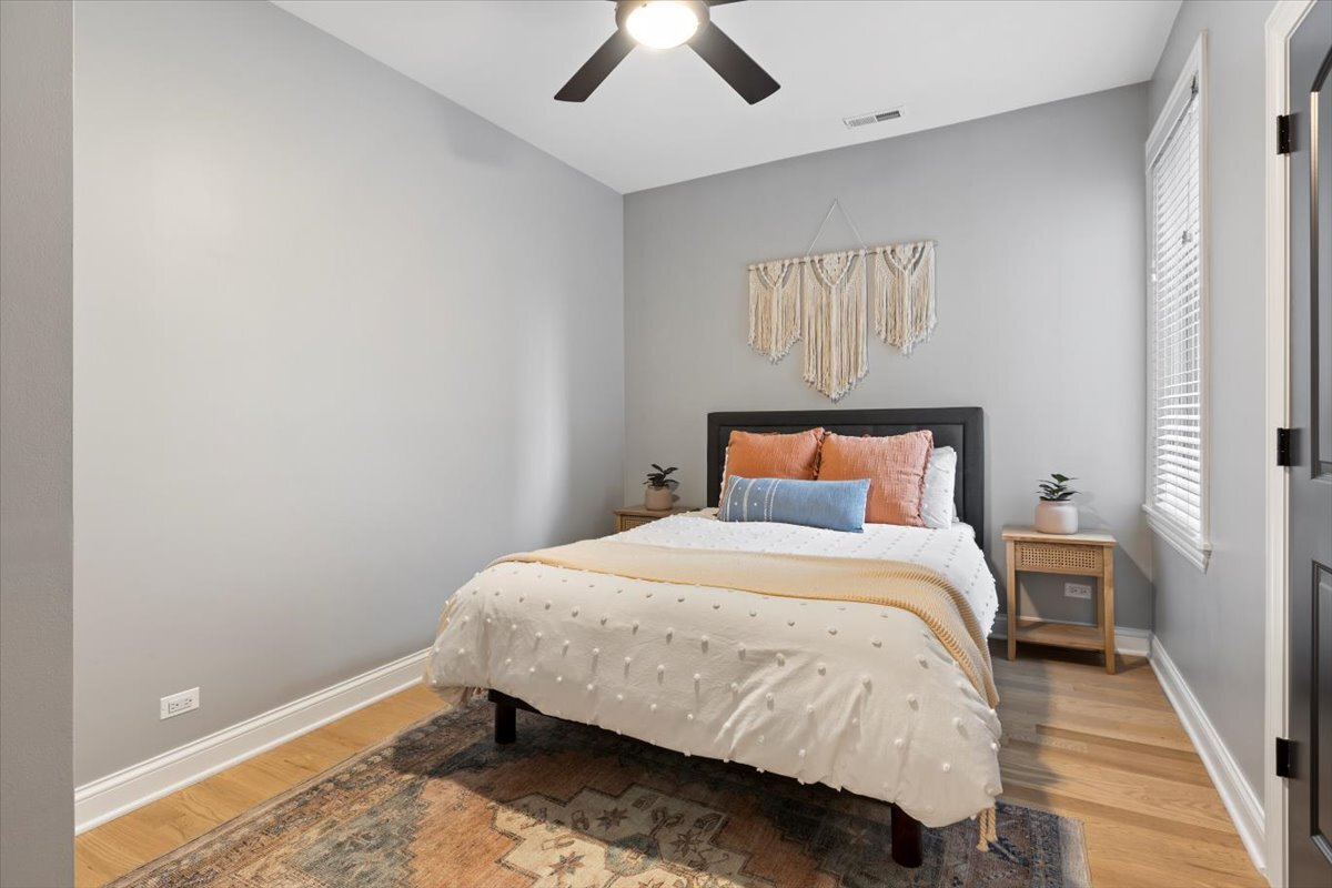 2463 West Foster Avenue, Unit 3 Chicago, IL 60625 - Photo 21 of 31 a bedroom with a bed and window