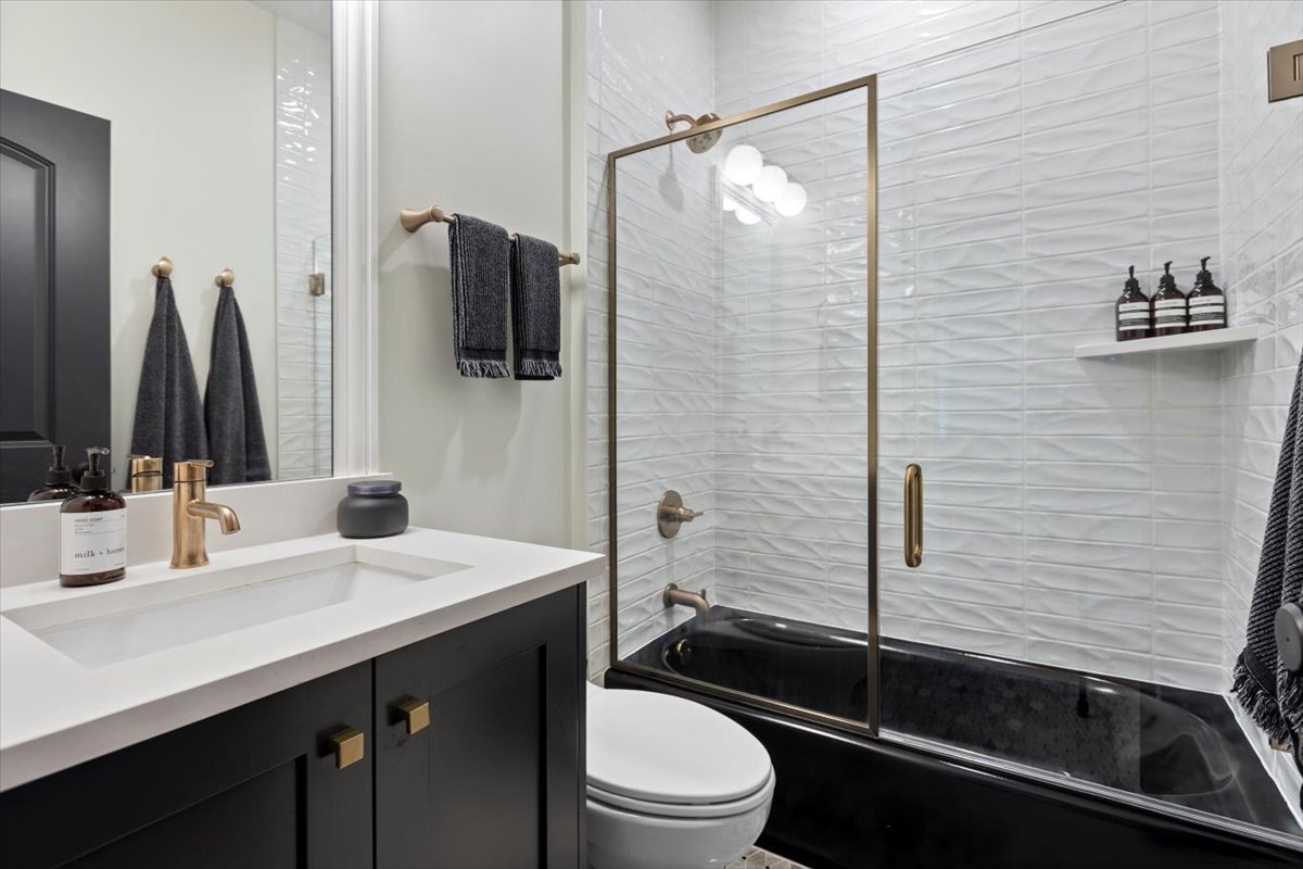 2463 West Foster Avenue, Unit 3 Chicago, IL 60625 - Photo 23 of 31 a bathroom with a sink a toilet and shower