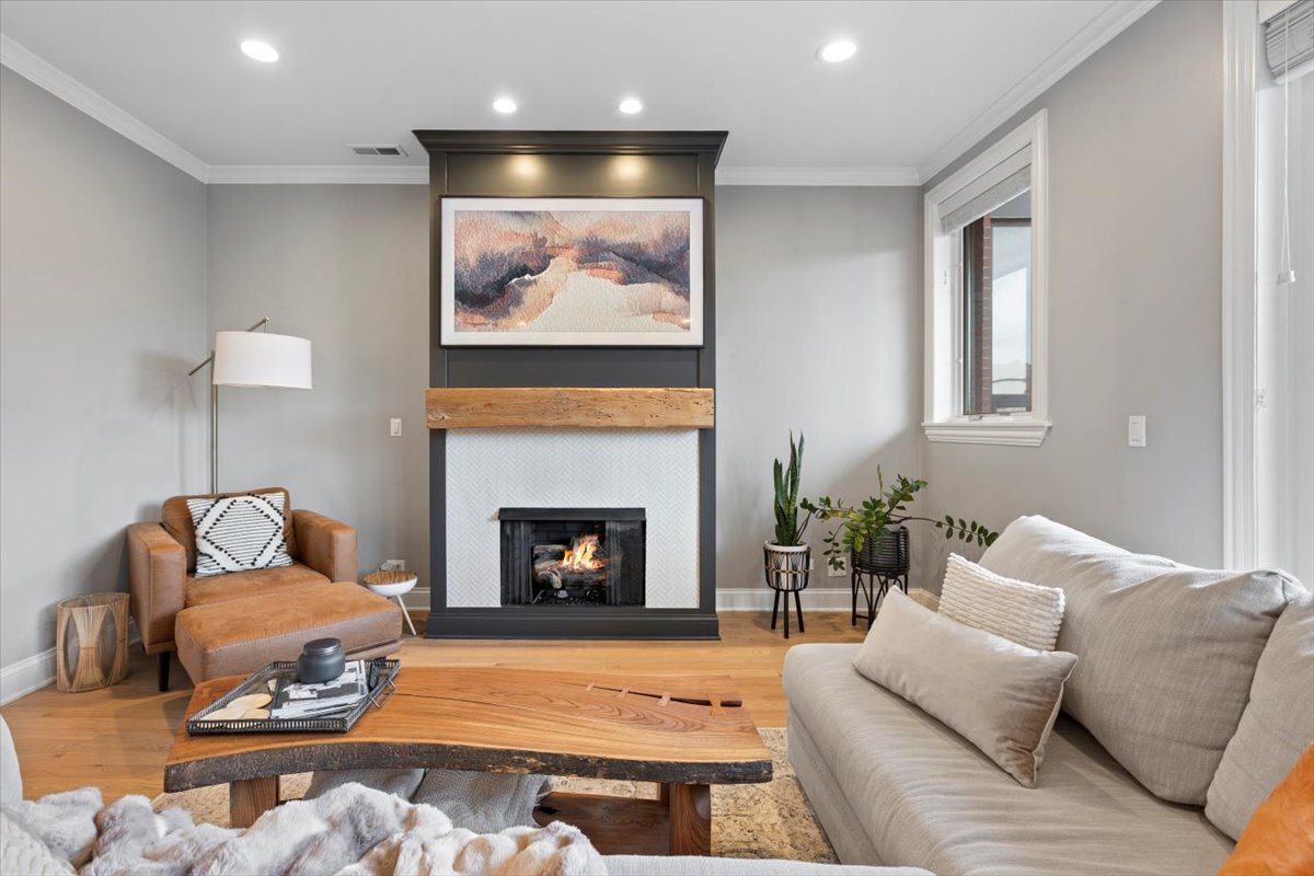 2463 West Foster Avenue, Unit 3 Chicago, IL 60625 - Photo 6 of 31 a living room with furniture and a fireplace