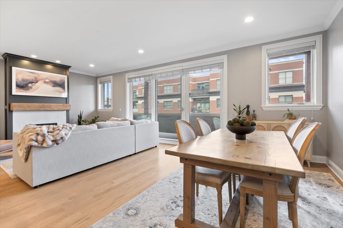 2463 West Foster Avenue, Unit 3 Chicago, IL 60625 - Photo 8 of 31 a living room with furniture a table and a large window