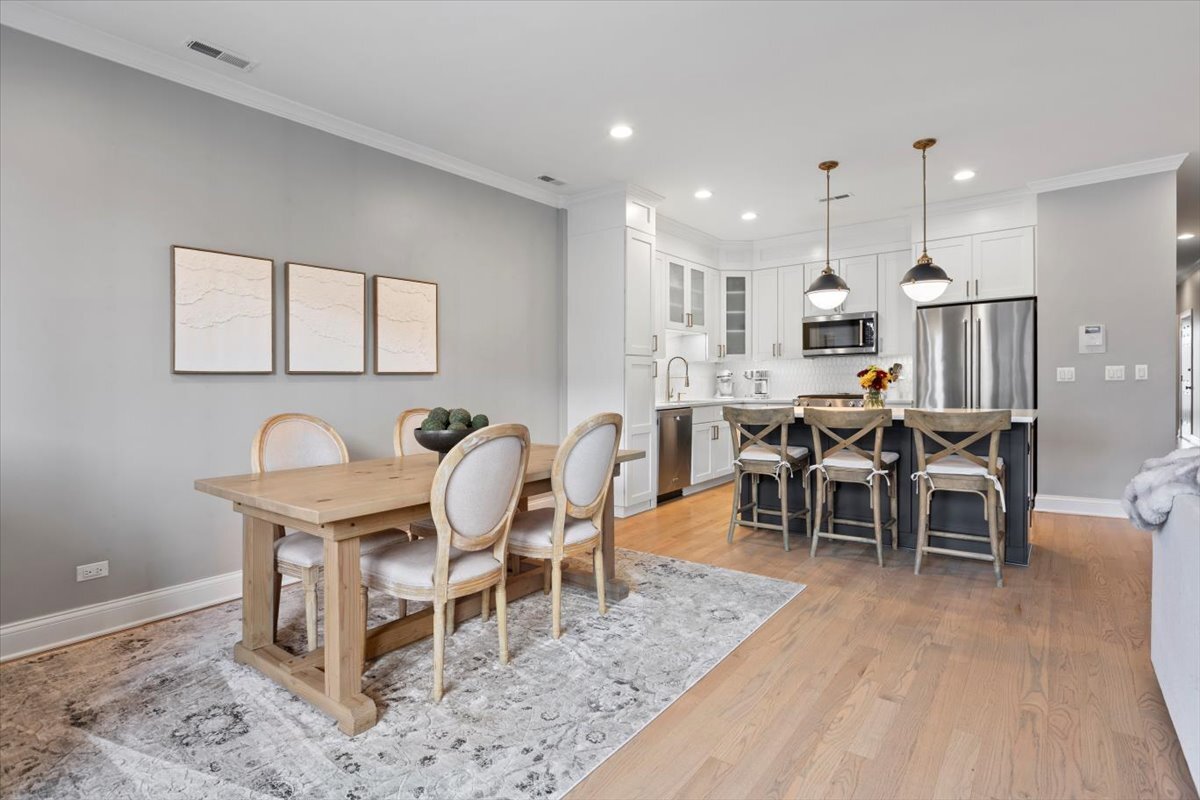 2463 West Foster Avenue, Unit 3 Chicago, IL 60625 - Photo 9 of 31 a view of a dining room with furniture