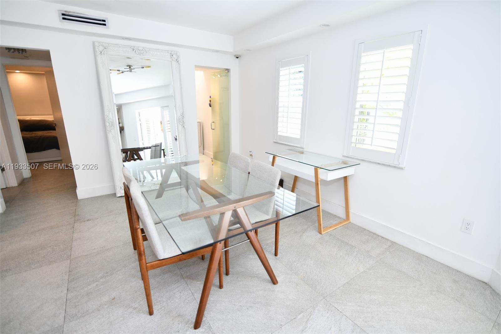 2918 Bird Avenue, Unit 5 Miami, FL 33133 - Photo 11 of 29 a view of a livingroom with furniture and a window