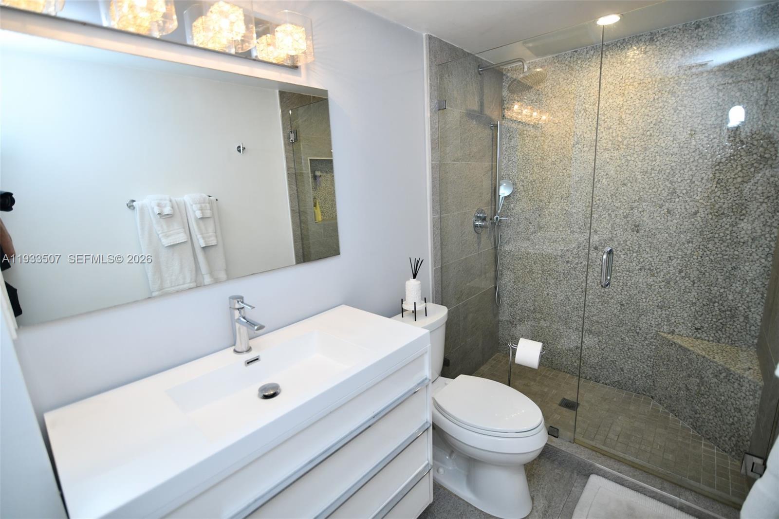 2918 Bird Avenue, Unit 5 Miami, FL 33133 - Photo 22 of 29 a bathroom with a sink toilet and shower