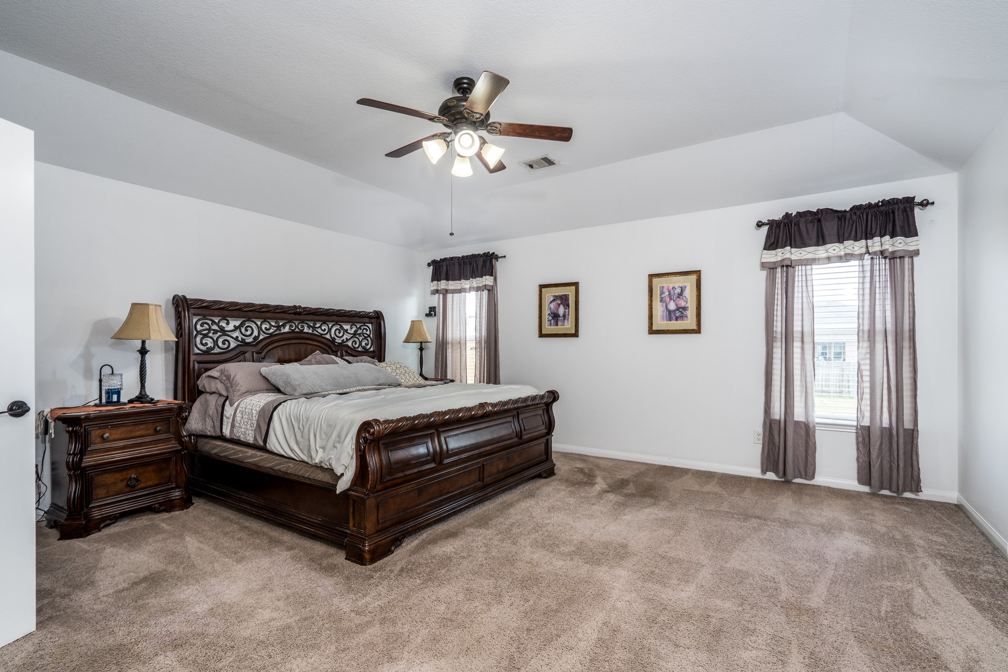 18879 Atascosa Trail Magnolia, TX 77355 - Photo 11 of 25 a bedroom with a bed and window
