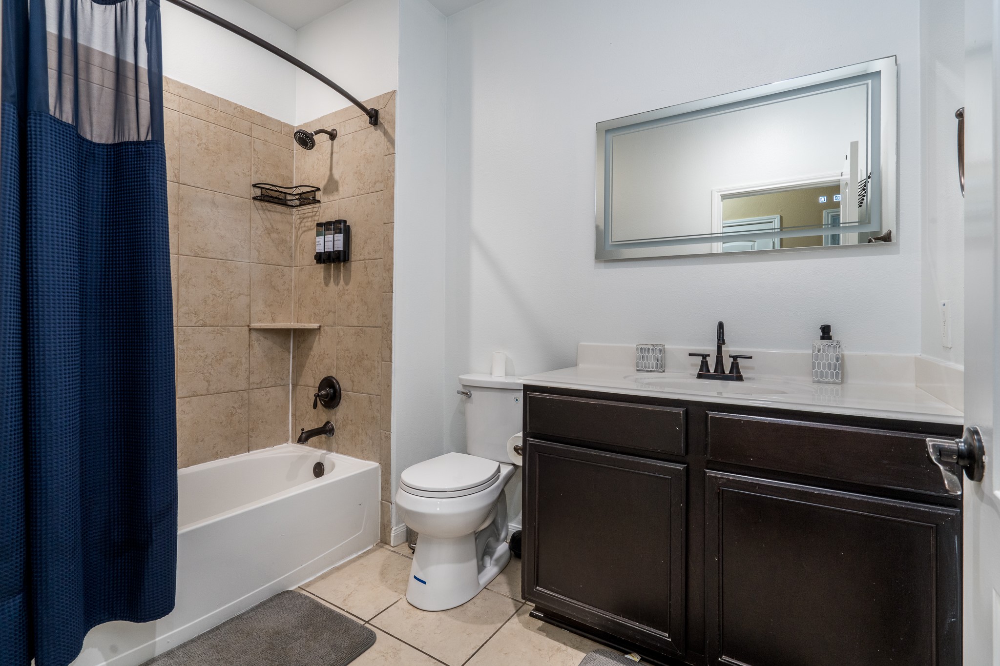 18879 Atascosa Trail Magnolia, TX 77355 - Photo 15 of 25 a bathroom with a sink toilet a shower and bathtub