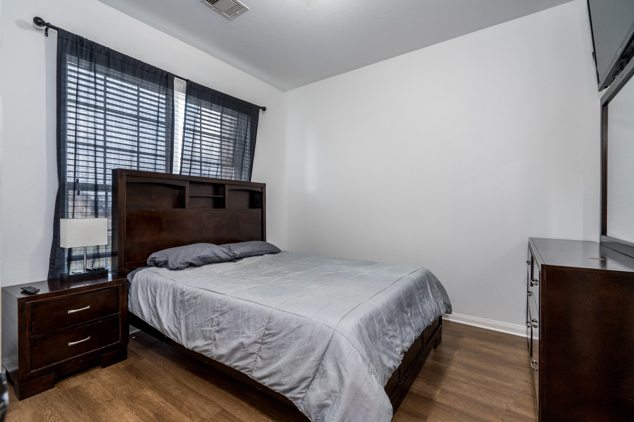 18879 Atascosa Trail Magnolia, TX 77355 - Photo 16 of 25 a bedroom with a bed and a window