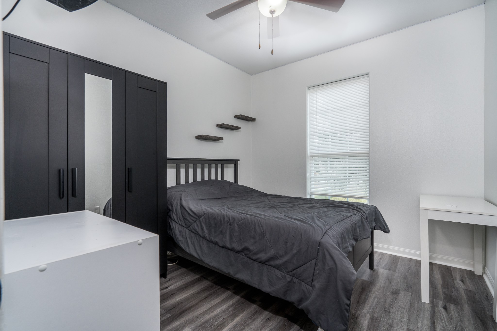 18879 Atascosa Trail Magnolia, TX 77355 - Photo 17 of 25 a bedroom with a bed and a chandelier