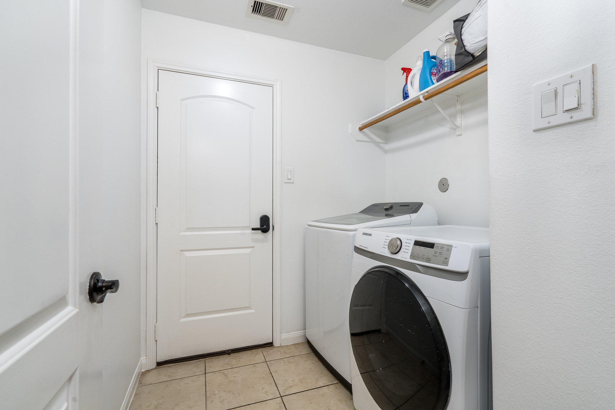 18879 Atascosa Trail Magnolia, TX 77355 - Photo 24 of 25 a utility room with dryer and washer