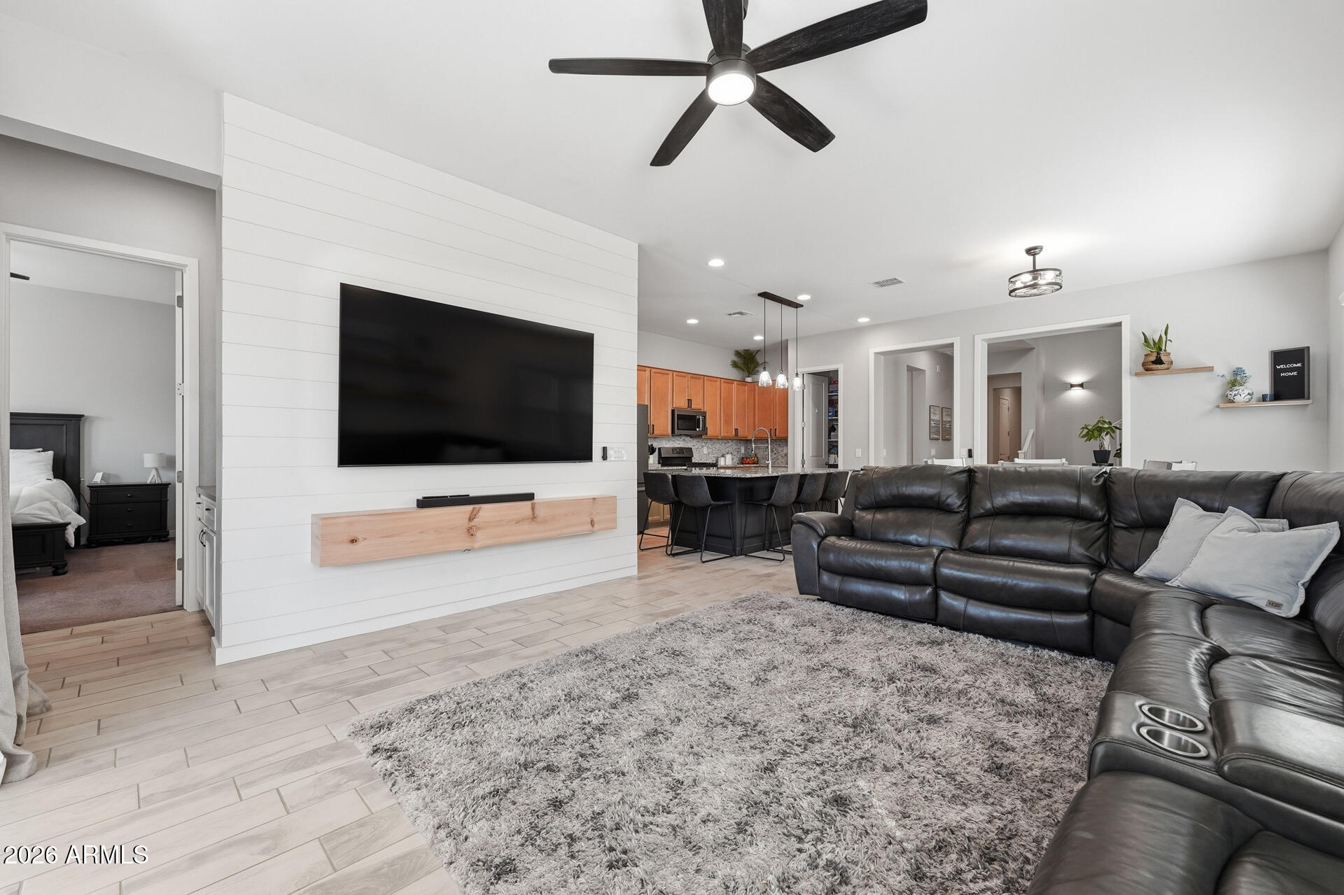 23069 East Mayberry Road Queen Creek, AZ 85142 - Photo 15 of 48 a living room with furniture and a flat screen tv
