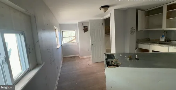 a kitchen with a refrigerator and a stove