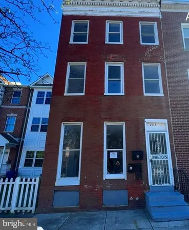 a red brick building that has lot of windows on it