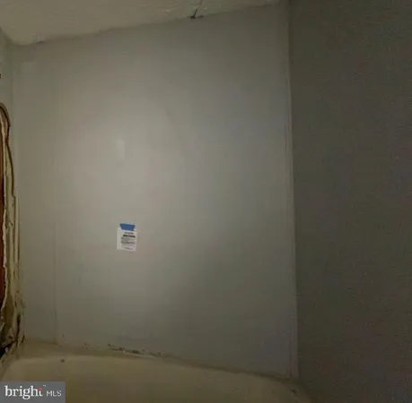 a white toilet sitting next to a sink