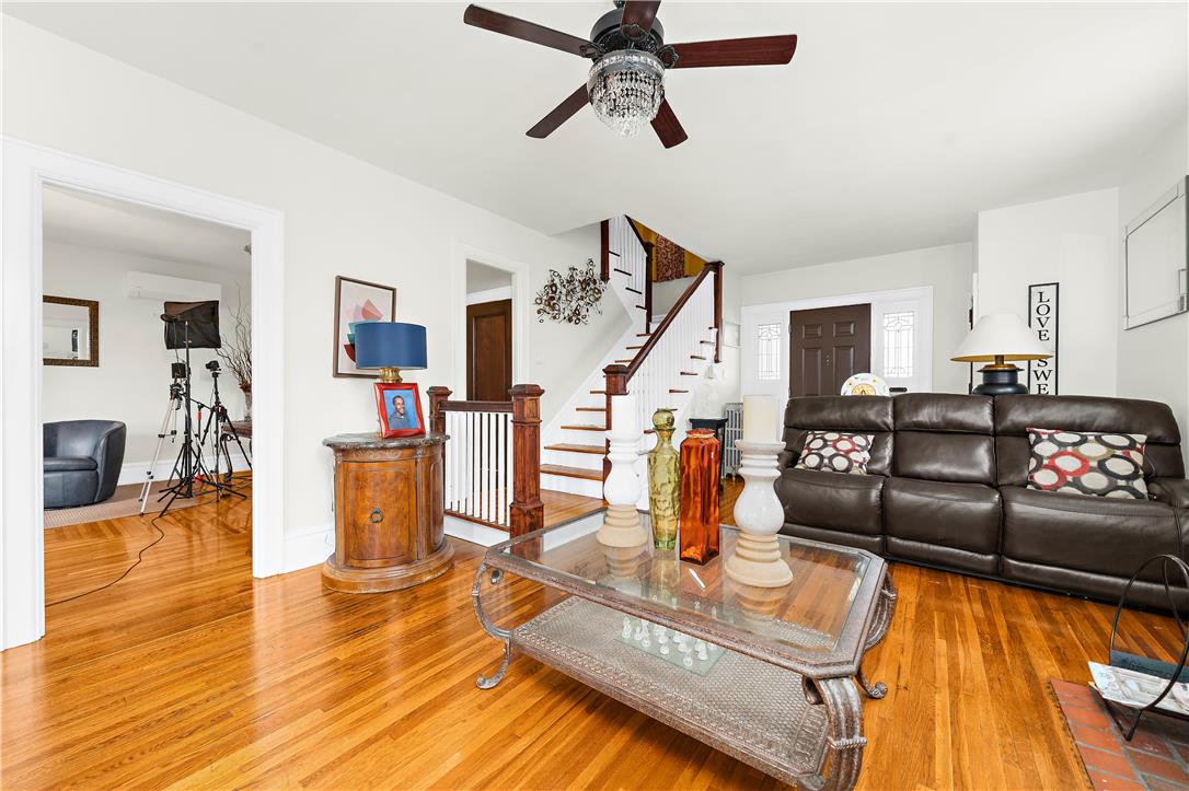 2055 Ferry Street Wilson, PA 18042 - Photo 3 of 21 Bright and airy living area with hardwood floors, a prominent staircase, and inviting spaces.