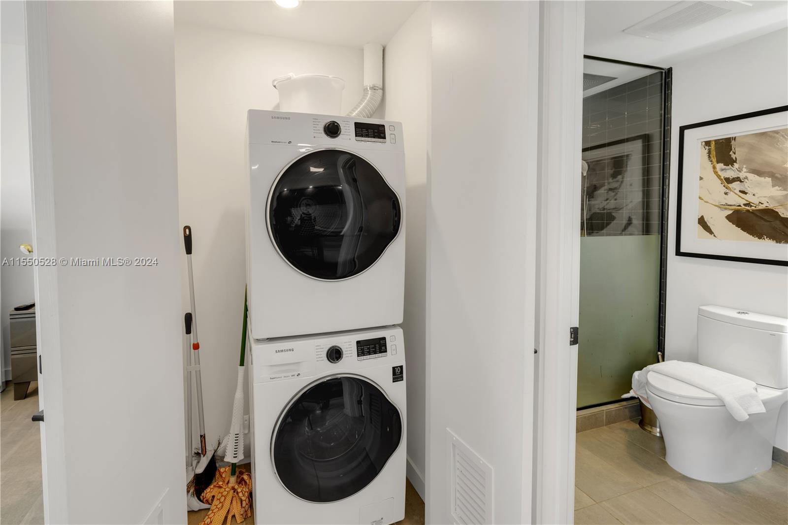 a view of a hallway with washer and dryer