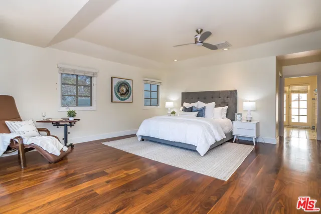 a bed room with a bed and a window