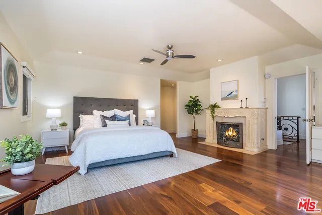 a bedroom with bed and window