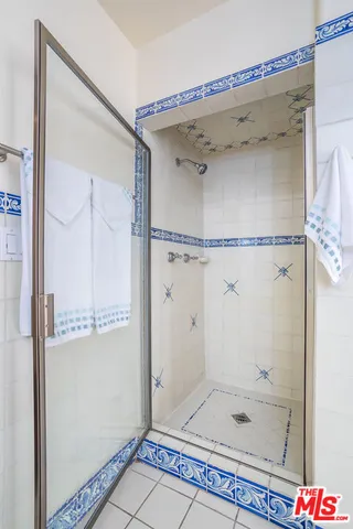 a front view of a house with a garden and yard