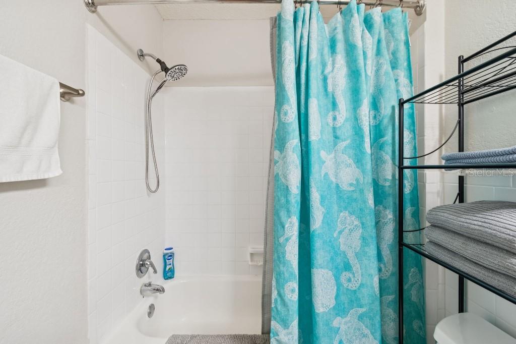 13125 Wilcox Road, Unit 6205 Largo, FL 33774 - Photo 24 of 48 a bathroom with a bathtub and shower