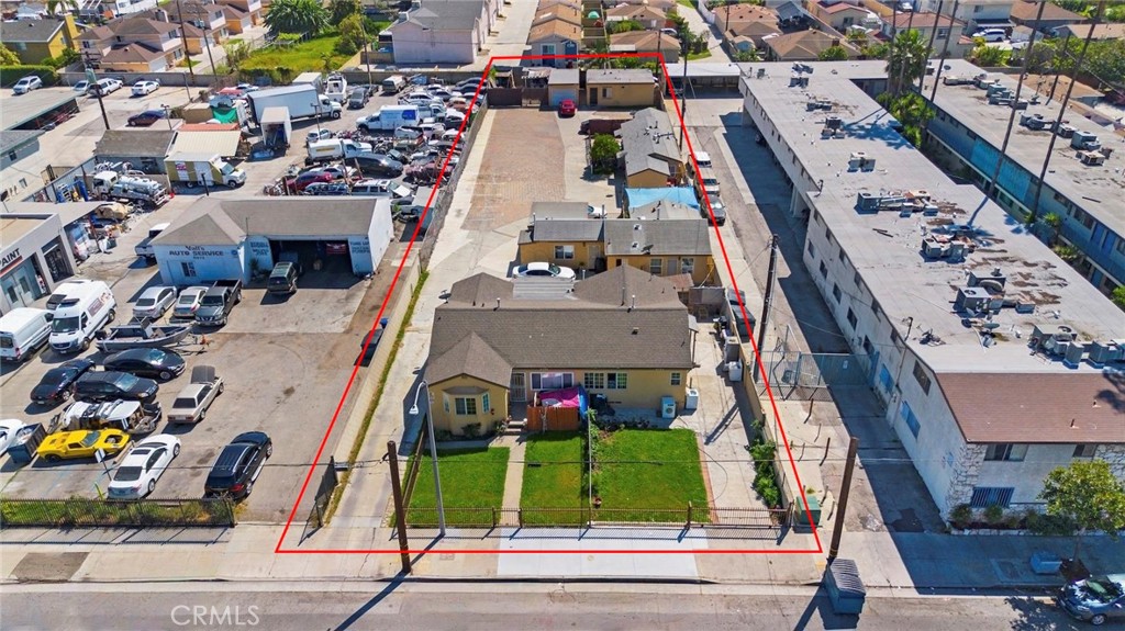 8564 Artesia Boulevard Bellflower, CA 90706 - Photo 18 of 20 an aerial view of multiple houses with yard