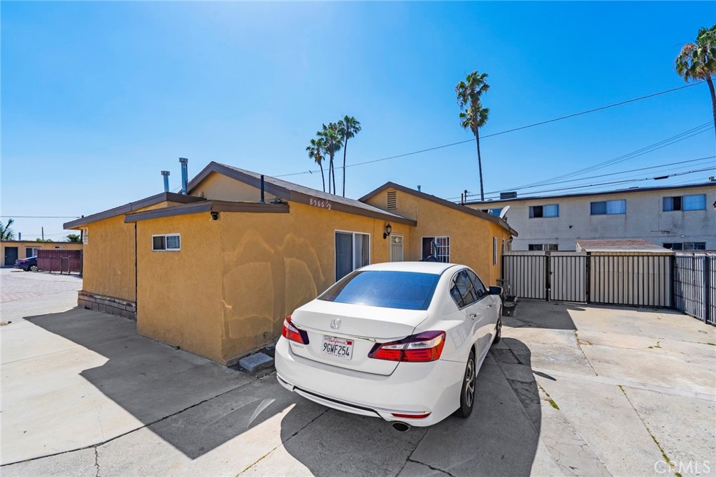 8564 Artesia Boulevard Bellflower, CA 90706 - Photo 4 of 20 a front view of a house with seating space