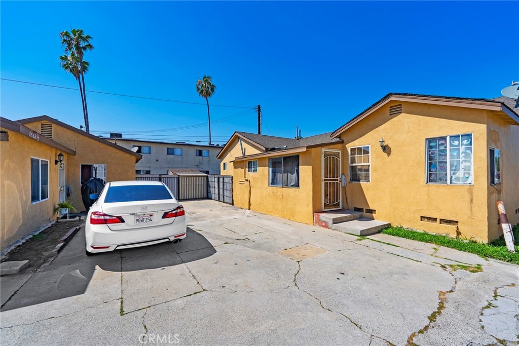 8564 Artesia Boulevard Bellflower, CA 90706 - Photo 5 of 20 a car parked in front of a house