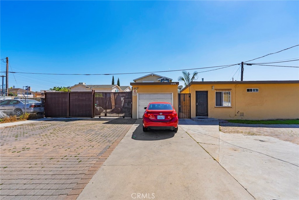 8564 Artesia Boulevard Bellflower, CA 90706 - Photo 7 of 20 a car parked in front of a house