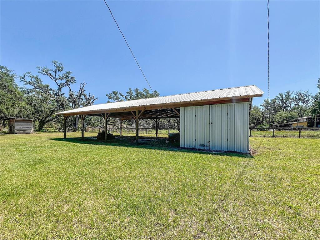 5870 Jim Davis Road Parrish, FL 34219 - Photo 33 of 39 Pole barn for boats, cars and RV hookup.