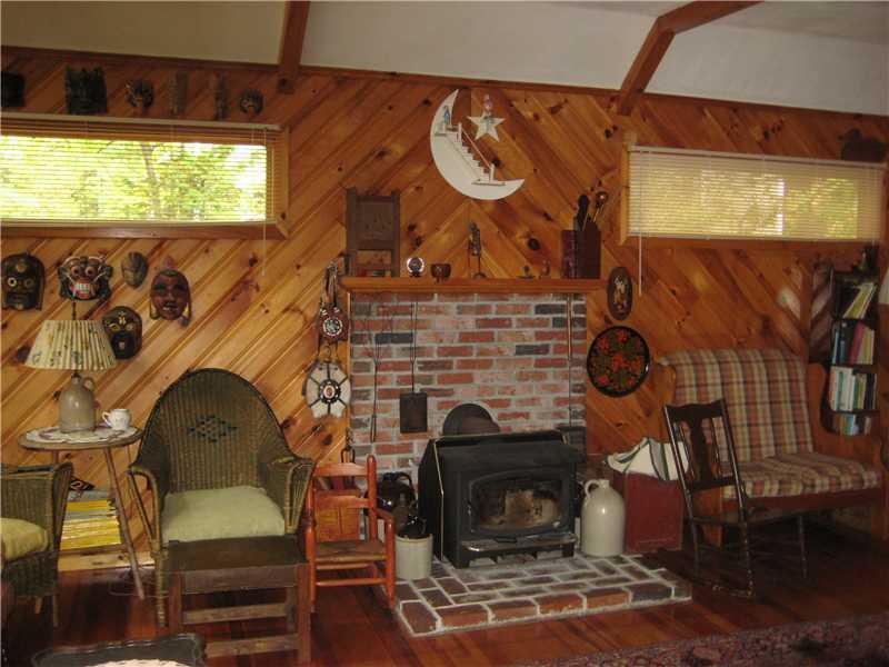 90 Snug Harbor Road Belgrade, ME 04917 - Photo 8 of 16 Living Room. Brick Hearth, wood...