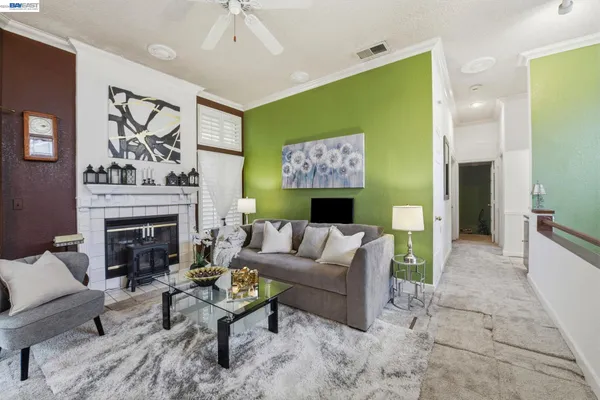 a living room with furniture and a fireplace