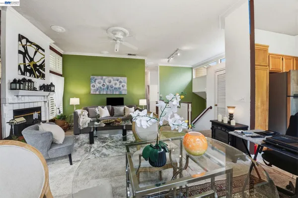 a living room with fireplace furniture and a flat screen tv