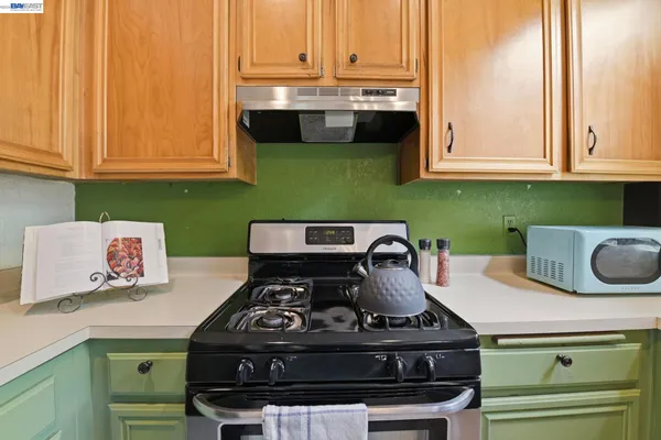 a close view of stove and microwave