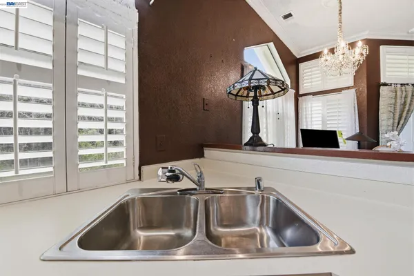 a kitchen that has a sink and a window
