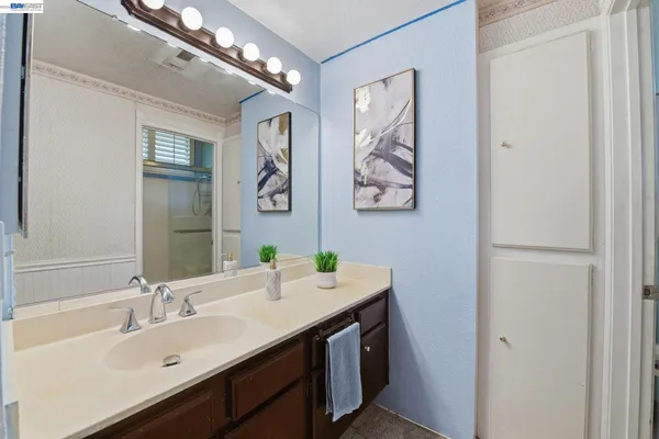 a bathroom with a sink and a mirror