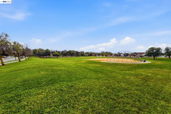 a view of a golf course with a lake