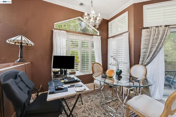 a work room with furniture and a window