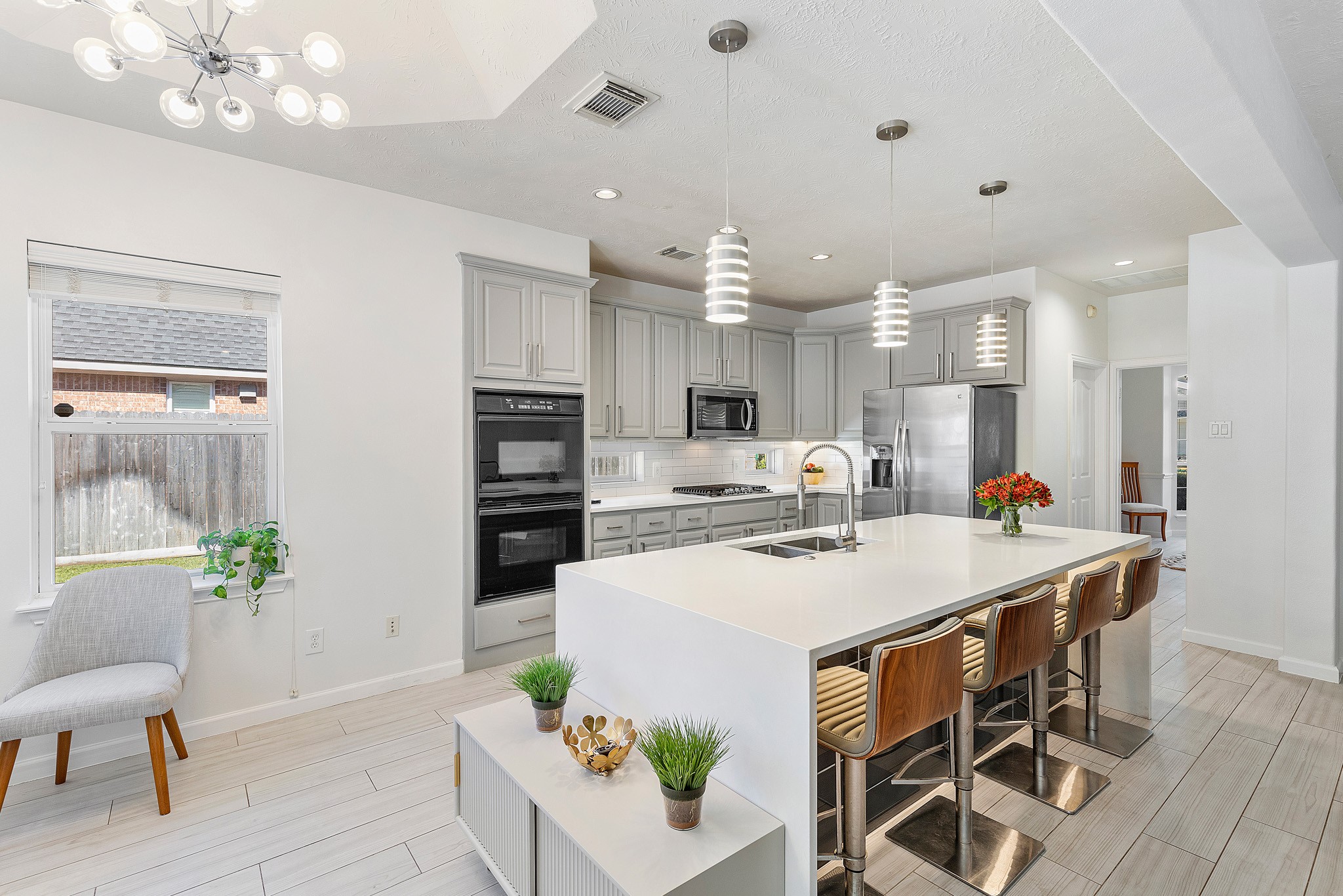 30 South Dulcet Hollow Circle Spring, TX 77382 - Photo 15 of 36 a large white kitchen with a table and chairs