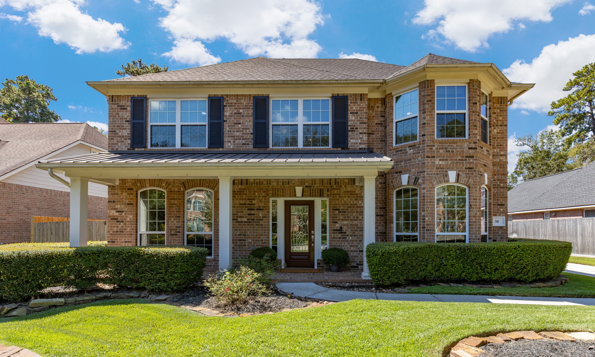 30 South Dulcet Hollow Circle Spring, TX 77382 - Photo 2 of 36 front view of a brick house with a yard