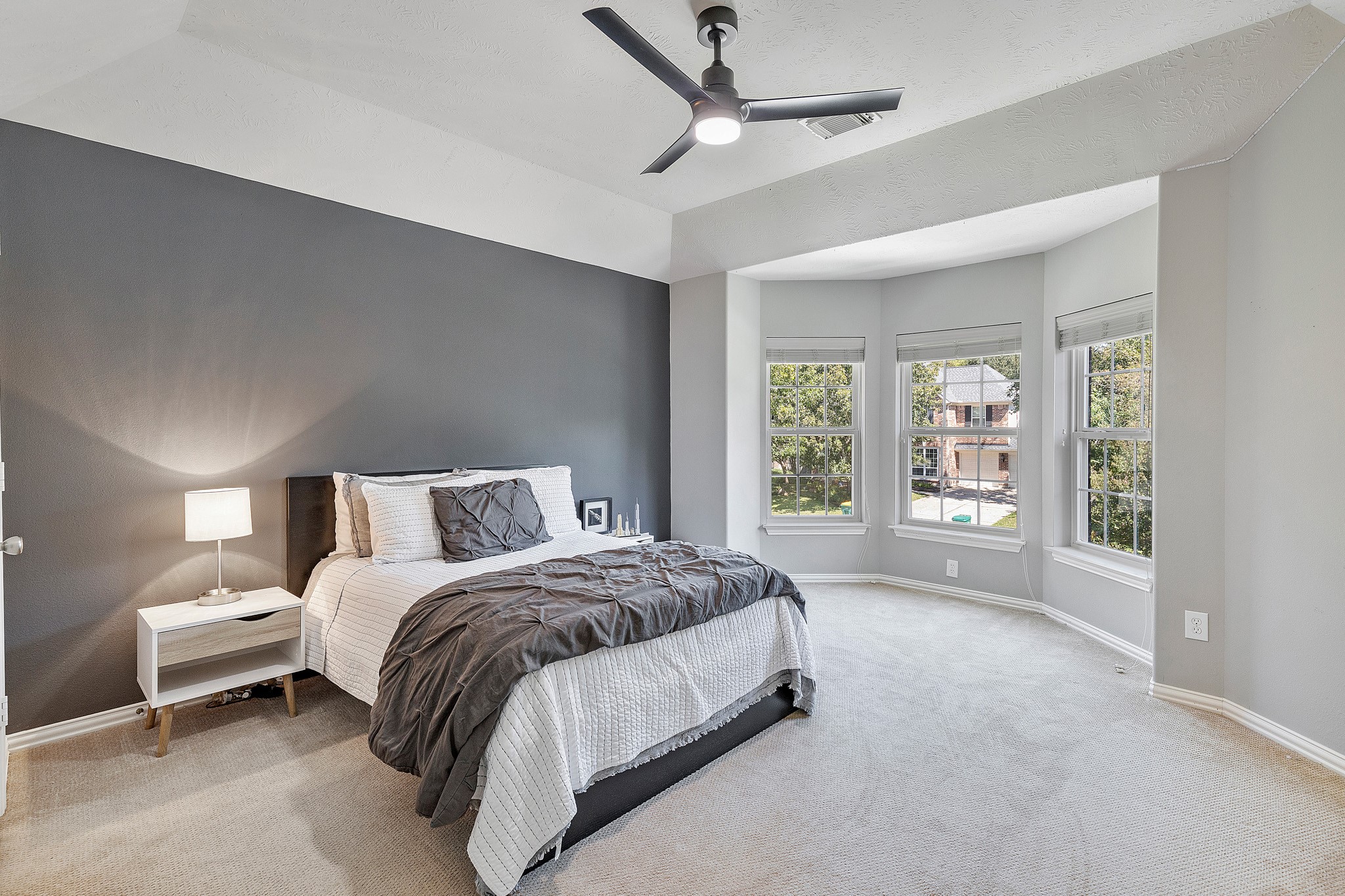 30 South Dulcet Hollow Circle Spring, TX 77382 - Photo 24 of 36 a spacious bedroom with a bed and a large window