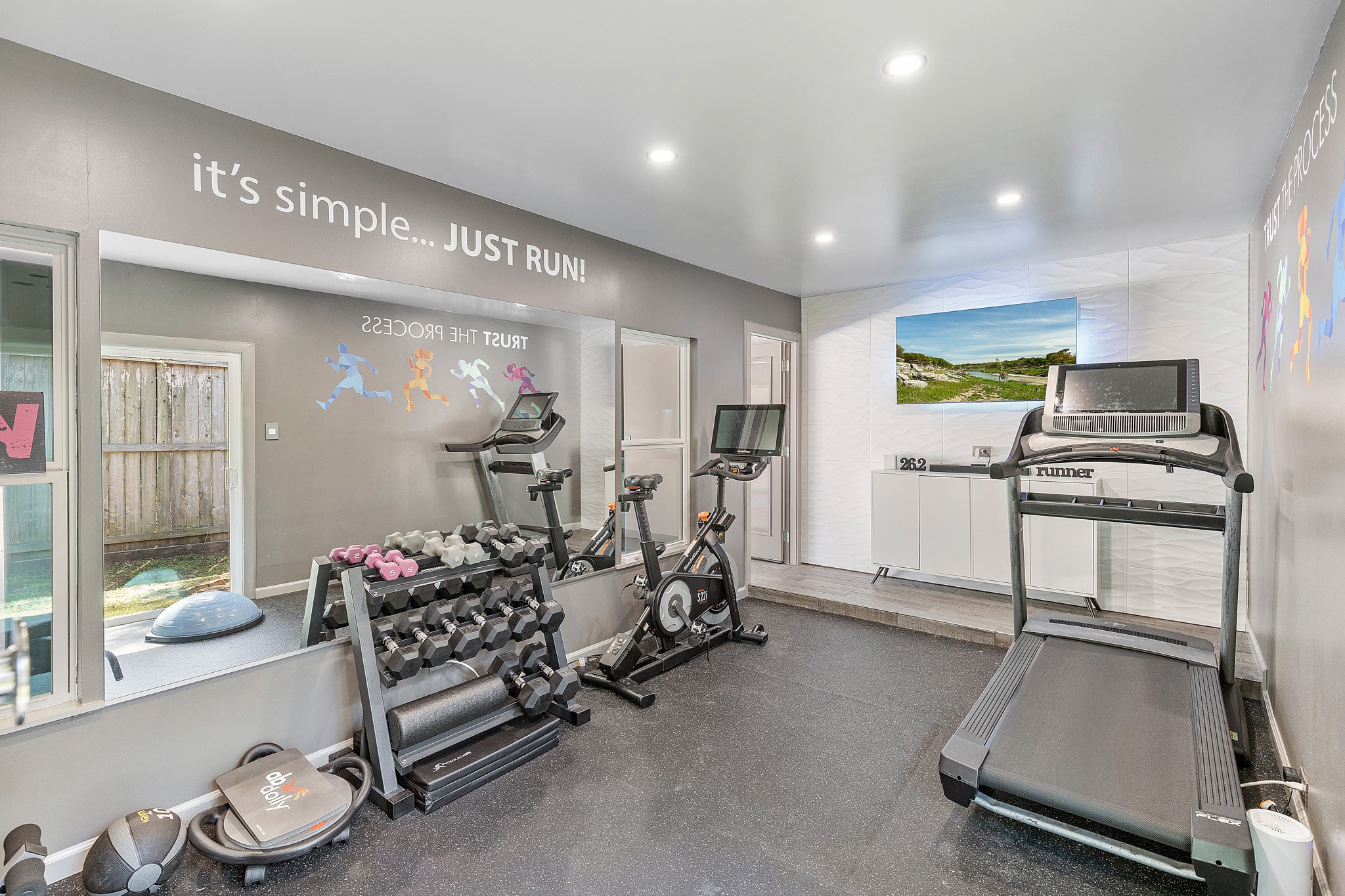 30 South Dulcet Hollow Circle Spring, TX 77382 - Photo 36 of 36 a room with gym equipment and wooden floor