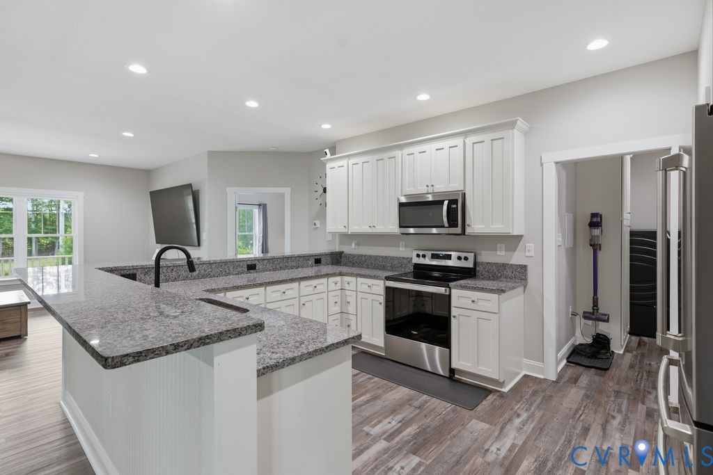 3259 Three Bridge Road Powhatan, VA 23139 - Photo 10 of 43 Kitchen featuring white shaker-style cabinetry, gr