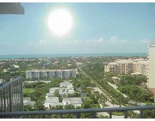 an aerial view of residential building and lake