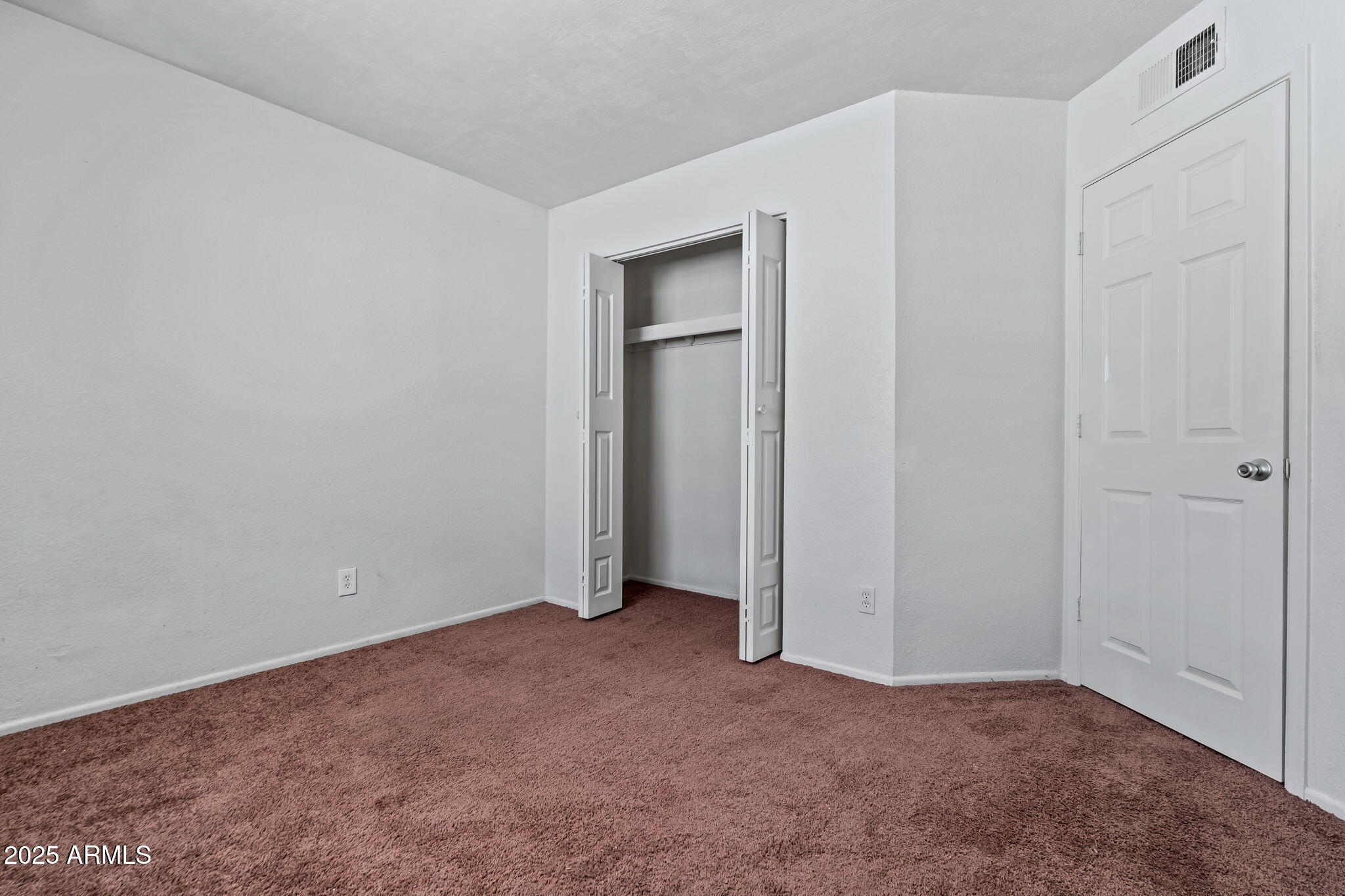 1742 East Pepper Circle, Unit 2 Mesa, AZ 85203 - Photo 14 of 26 a view of an empty room