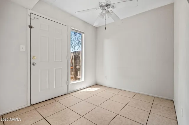 a view of an empty room and window
