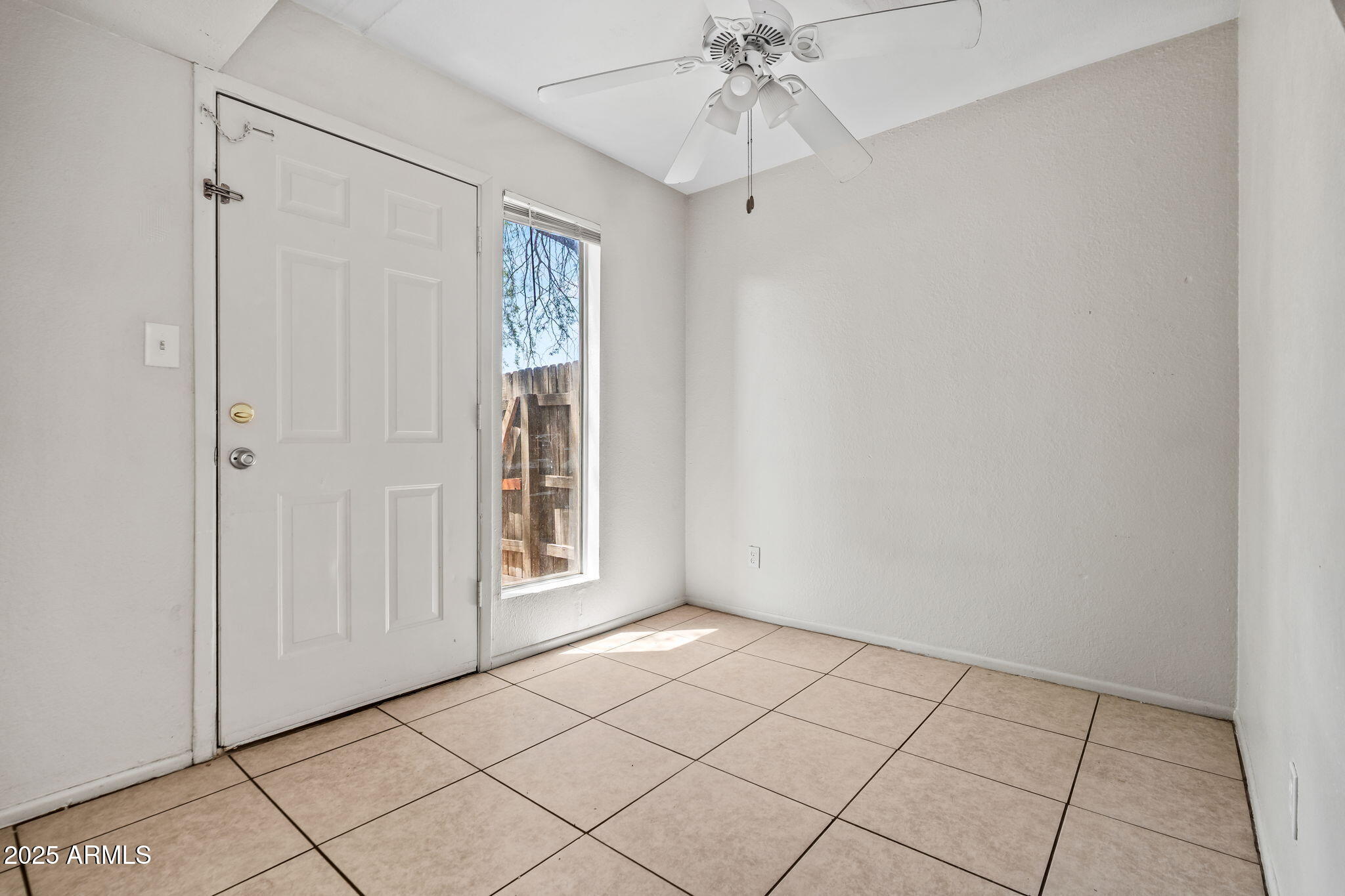 1742 East Pepper Circle, Unit 2 Mesa, AZ 85203 - Photo 10 of 26 a view of an empty room and window
