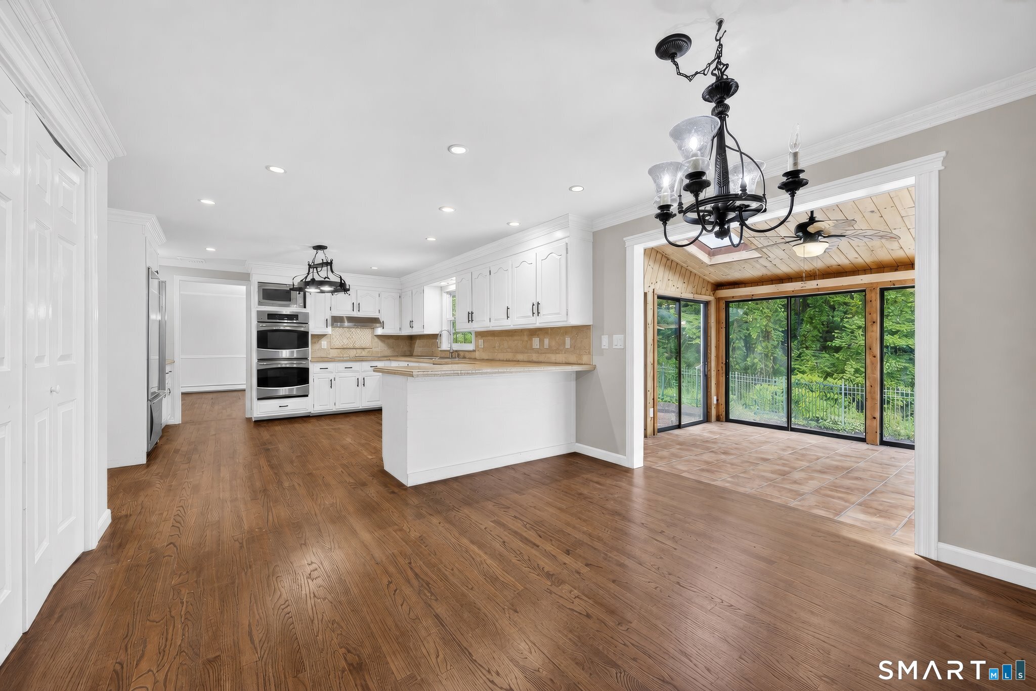 70 Barrack Hill Road Ridgefield, CT 06877 - Photo 7 of 32 a view of a kitchen with a sink wooden cabinet and a counter top space