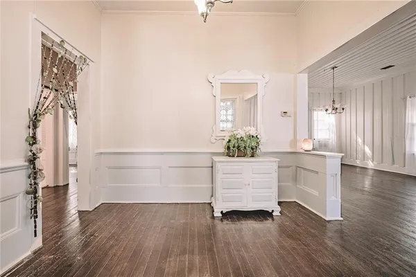 a view of an entryway and wooden floor