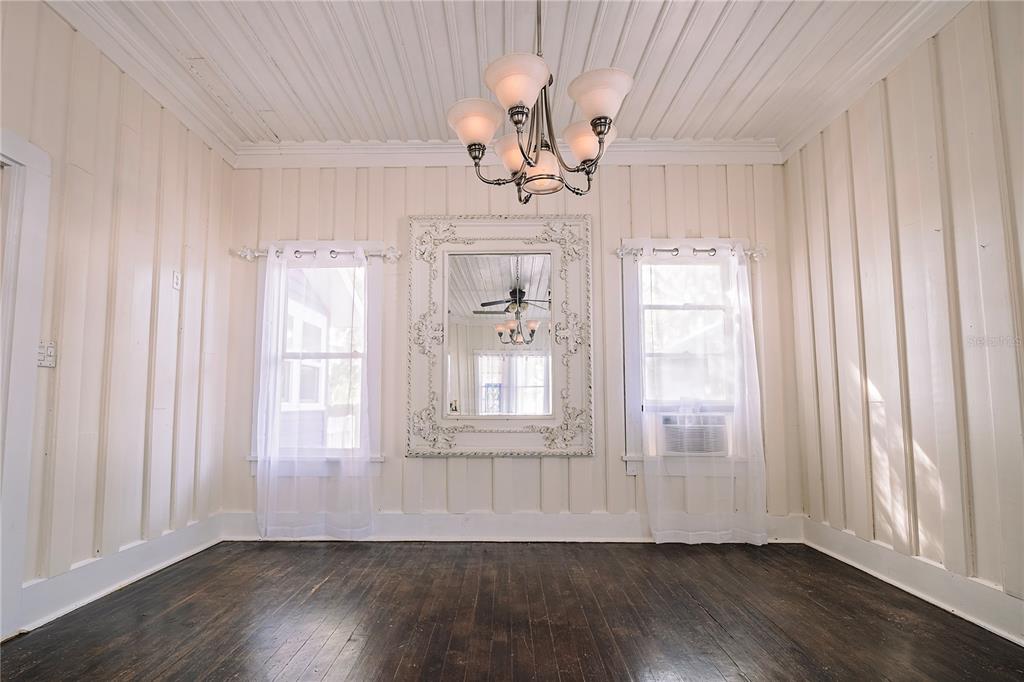 510 East Key Avenue Eustis, FL 32726 - Photo 14 of 40 a view of an empty room with wooden floor and a window