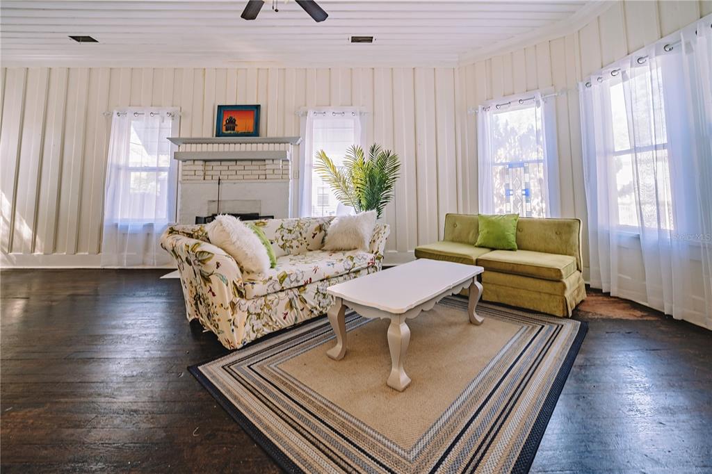 510 East Key Avenue Eustis, FL 32726 - Photo 17 of 40 a living room with furniture and a wooden floor